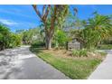 Landscaped entrance to Woodside Village East community at 6906 Woodwind Dr # 12, Sarasota, FL 34231