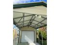 Interior view of carport showing garage door and lighting at 782 Londra Dr, Venice, FL 34285