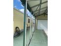 Covered carport with attached garage and side yard access at 782 Londra Dr, Venice, FL 34285