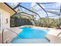 Inviting screened pool and spa with ample space for relaxation at 793 Vanderbilt Dr, Nokomis, FL 34275