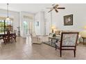 Spacious living room with tiled floors and comfortable seating at 804 Amaryllis Ln, Venice, FL 34292