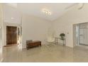 Open living area with tile floors and a hanging chair at 4765 Oak Forest W Dr # 47, Sarasota, FL 34231
