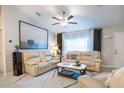 Open concept living room featuring comfortable seating and neutral color palette at 5268 Delight Ave, North Port, FL 34288