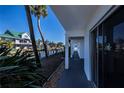 Private back patio with access to waterfront and tropical landscaping at 902 Gibbs Rd # 183, Venice, FL 34285