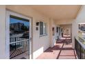 Condo hallway with access to unit featuring tiled floors at 250 Santa Maria St # 219, Venice, FL 34285