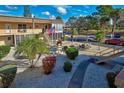 Condo community with lush landscaping and parking at 537 Manatee Ct # 204, Venice, FL 34285