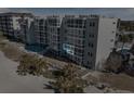 Ocean view condo building with pool and beach access at 950 Tarpon Center Dr # 202, Venice, FL 34285