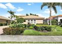 Well-maintained house with attractive landscaping and a paved driveway at 134 Savona Way, North Venice, FL 34275