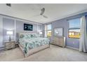 Bright main bedroom with a king-size bed and plenty of closet space at 20428 Lagente Cir, Venice, FL 34293