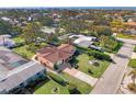 Aerial view showing home's location in a residential neighborhood near the coast at 225 Firenze W Ave, Venice, FL 34285