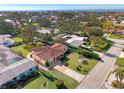 Aerial view of a single Gathering home and neighborhood with ocean views at 225 Firenze W Ave, Venice, FL 34285