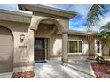 Columns and arched entry with decorative door at 23102 Madelyn Ave, Port Charlotte, FL 33954