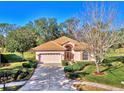 One-story home with tile roof and driveway at 2331 Harrier Way, Nokomis, FL 34275