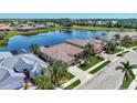 House with a tile roof, located in a golf course community at 2878 Egret Ct, North Port, FL 34287