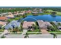Property view showcasing home's location near water and golf course at 2878 Egret Ct, North Port, FL 34287