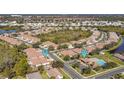 Community overview showcasing homes, pool, and lush green spaces at 5255 Athens Way, Venice, FL 34293