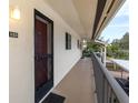 Exterior view of condo with walkway and balcony access at 533 Parkdale Mews # 533, Venice, FL 34285