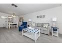 Coastal-themed living area with comfortable seating and coordinated decor at 533 Parkdale Mews # 533, Venice, FL 34285