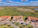 Aerial view showcasing a townhome community with nature views at 10039 Crooked Creek Dr # 203, Venice, FL 34293