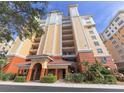 Condo building exterior with a grand entrance and lush landscaping at 157 Tampa E Ave # 807, Venice, FL 34285