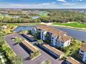 Condo building aerial view, showcasing parking and landscaping at 17118 Vardon Ter # 202, Bradenton, FL 34211