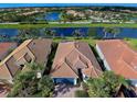 Aerial view of a luxury home community with water features and lush landscaping at 19279 Jacinda St, Venice, FL 34293