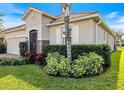 Single-Gathering home with tile roof, two-car garage, and landscaped yard at 2049 Mesic Hammock Way, Venice, FL 34292