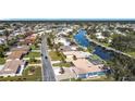 Bird's eye view of a waterfront community with numerous homes and canals at 4 Windsor Dr, Englewood, FL 34223