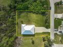 House and yard from above, showing a large grassy area at 4130 Rock Creek Dr, Port Charlotte, FL 33948
