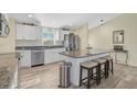 Modern kitchen with granite countertops and island seating at 6297 Drucker Cir, Port Charlotte, FL 33981