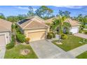 Single-Gathering home with attached garage and lush landscaping at 125 Amora Ave, Venice, FL 34285
