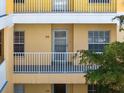 Condo building exterior, showcasing the building's facade and balcony at 2081 Willow Hammock Cir # F204, Punta Gorda, FL 33983
