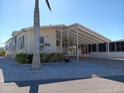 Front view of a manufactured home with carport at 657 N Green Cir # 182, Venice, FL 34285