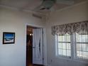 Bright sunroom with windows and access to other rooms at 657 N Green Cir # 182, Venice, FL 34285