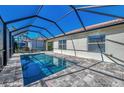 Screened-in pool and patio area, perfect for outdoor entertaining with a spacious deck and sunny skies at 11679 Anhinga Ave, Venice, FL 34292