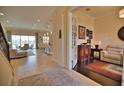 Bright and spacious entryway with views into the living room and office at 140 Maraviya Blvd, Nokomis, FL 34275