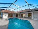 Sparkling screened-in pool offering a refreshing oasis for relaxation and enjoyment at 1678 Quail Lake Dr, Venice, FL 34293