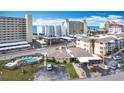 Condo complex featuring a refreshing pool and well-maintained grounds at 200 The Esplanade N # A7, Venice, FL 34285