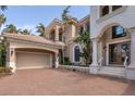 Exterior of home with brick driveway and attached garage; covered front entry at 457 Anchorage Dr, Nokomis, FL 34275