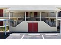 Condo building entrance with stairs and parking at 509 Parkdale Mews # 509, Venice, FL 34285