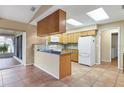 Kitchen with granite countertops and light wood cabinets at 5221 Lemon Bay Dr, Venice, FL 34293