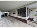 Covered carport alongside the manufactured home at 611 50Th Avenue W Dr, Bradenton, FL 34207