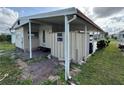 Side view of the manufactured home showcasing additional storage at 611 50Th Avenue W Dr, Bradenton, FL 34207