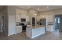 Modern kitchen featuring stainless steel appliances, granite countertops and white cabinets at 14464 Fort Myers Ave, Port Charlotte, FL 33981