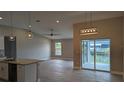 Open floor plan featuring tile flooring, neutral colors and modern light fixtures at 14464 Fort Myers Ave, Port Charlotte, FL 33981