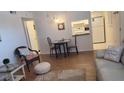 Cozy dining area with a view of the kitchen, and a beachy decorative theme at 300 Base E Ave # 123, Venice, FL 34285