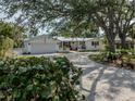 Beautiful home with a spacious driveway and a well-maintained lawn at 705 Armada N Rd, Venice, FL 34285
