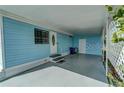 Covered carport area offering ample parking and storage, featuring light blue siding at 356 Longwood Dr, Venice, FL 34285