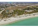 Stunning aerial view highlighting the condo's proximity to the beach, park, and airport at 1423 Avenida Del Circo # 1C, Venice, FL 34285