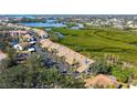 A beautiful aerial view of condos nestled amongst mangroves and waterways at 1106 Bird Bay Way # 316, Venice, FL 34285